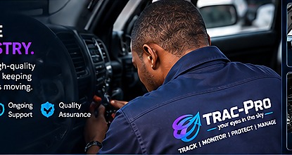 Trac-Pro technician working on a vehicle